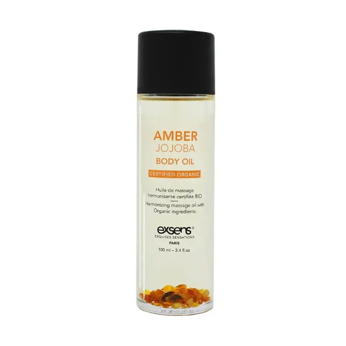 Bottle of Exsens Amber Jojoba Crystal Body Oil with amber crystals and hydrating jojoba oil