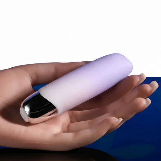 Hand holding Bunny Bunch soft squishy bullet vibrator showing compact size and opal gradient design