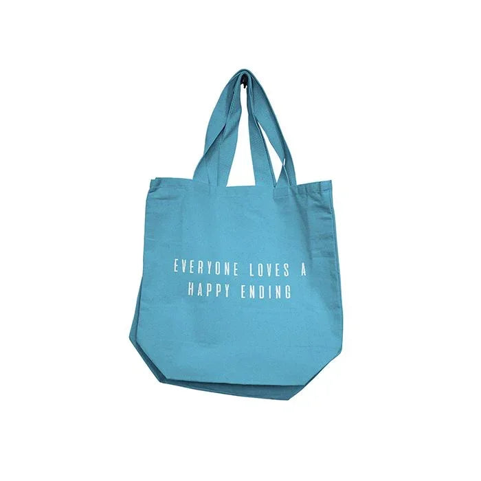 Blue tote bag with “Everyone Loves a Happy Ending” graphic print on white background