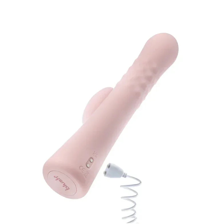 Close-up of Blush Jaymie vibrator’s magnetic USB charging port showing the charging cable securely attached for easy and safe recharging.