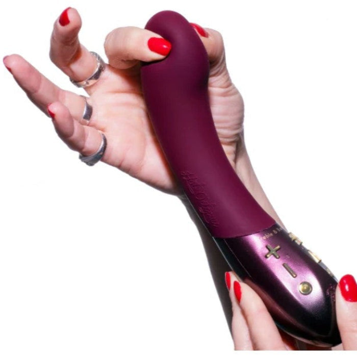 Kurve G-Spot toy held in a woman’s hands, showcasing its unique soft gel tip and premium silicone finish