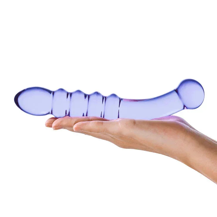 woman holding the Purple Rain Ribbed Glass Dildo in her hand