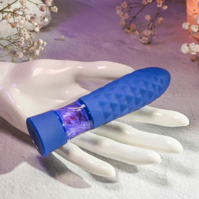 Lifestyle image of woman holding the compact rechargeable silicone mini bullet with 8 vibration speeds