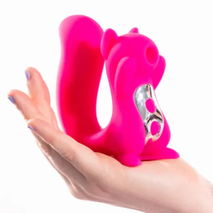 Woman holding the Screaming Squirrel dual stimulation vibrator for clitoral and internal pleasure in her hand