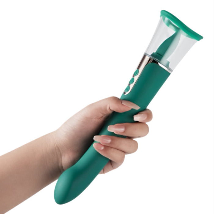 Hand holding a green succion Lick Suck Vibrating Massager on a white background