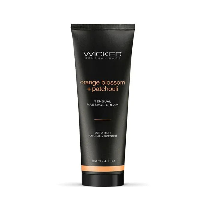 Front view of Wicked Sensual Massage Cream in Orange Blossom + Patchouli scent 4 oz jar, showcasing elegant label and packaging