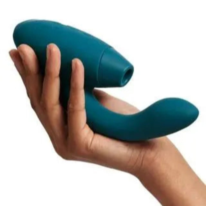 Woman holding the Womanizer Duo 2 waterproof rechargeable rabbit vibrator featuring Pleasure Air Technology and independent dual motors