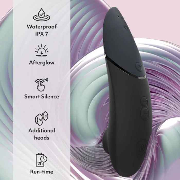 Close-up of Womanizer Next showing soft-touch silicone surface, control buttons and features