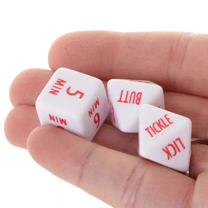 Tempt & Tease Dice with red text showing playful actions and time limits, held in a person's hand on a white background