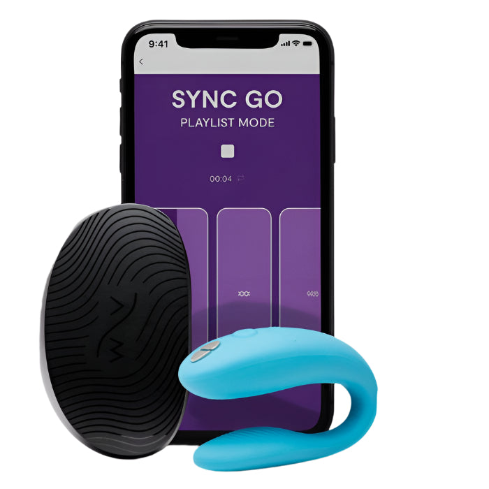 Blue We-Vibe Sync Go couples vibrator positioned beside its compact travel case, highlighting the smooth, body-safe silicone finish. An iPhone displaying the We-Vibe Sync Go app interface sits next to the set, emphasizing app-controlled features.