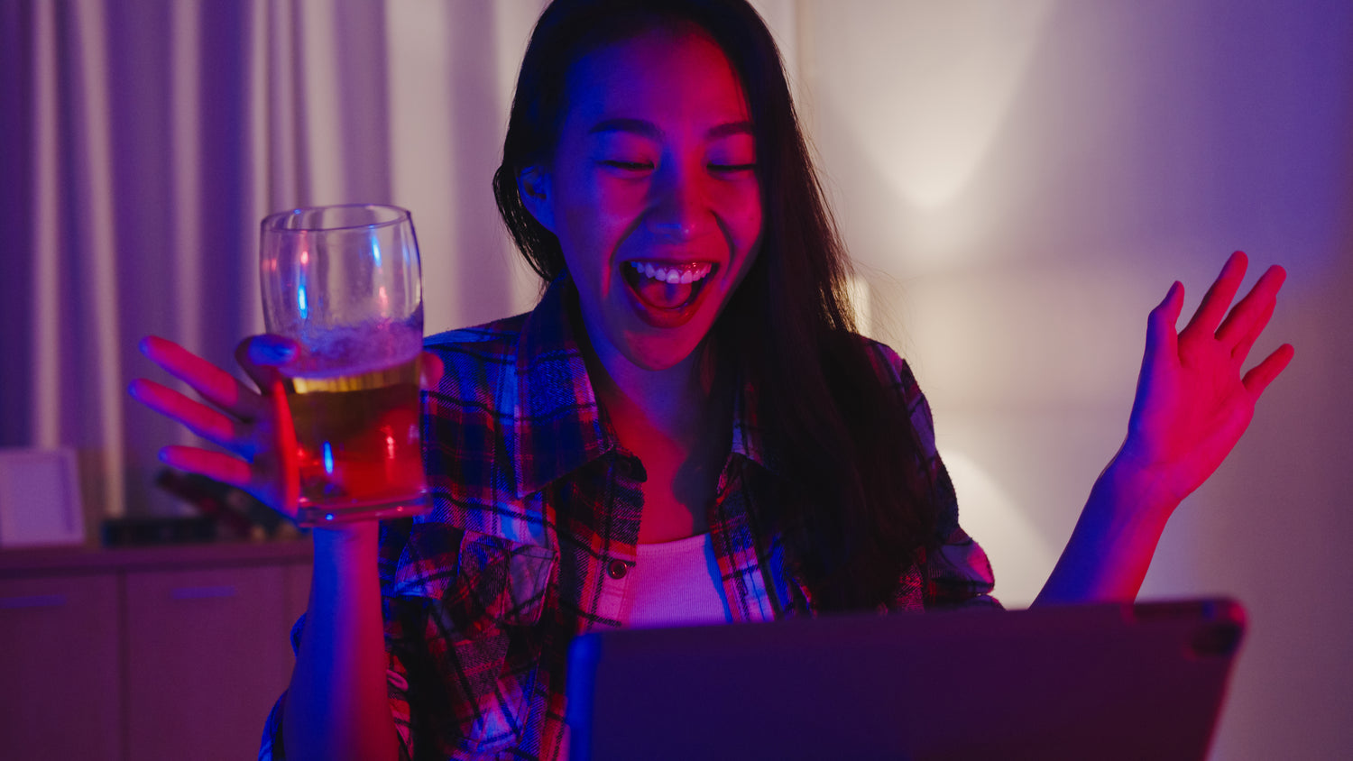 Woman enjoying a fun, body-positive virtual sexual wellness party with The Flirtation Station.