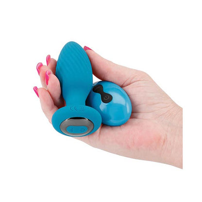 woman holding Alpine Gyrating Anal Plug w/ Remote in her hands