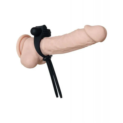 Black Tie Affair vibrating ring worn on realistic dildo, demonstrating proper placement with textured platform positioned for external stimulation and ribbon ties secured.
