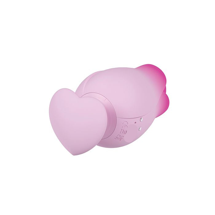 Pink Tulip Trance clitoral stimulator featuring the heart-shaped ergonomic base and a close-up of the silicone surface and magnetic USB charging port