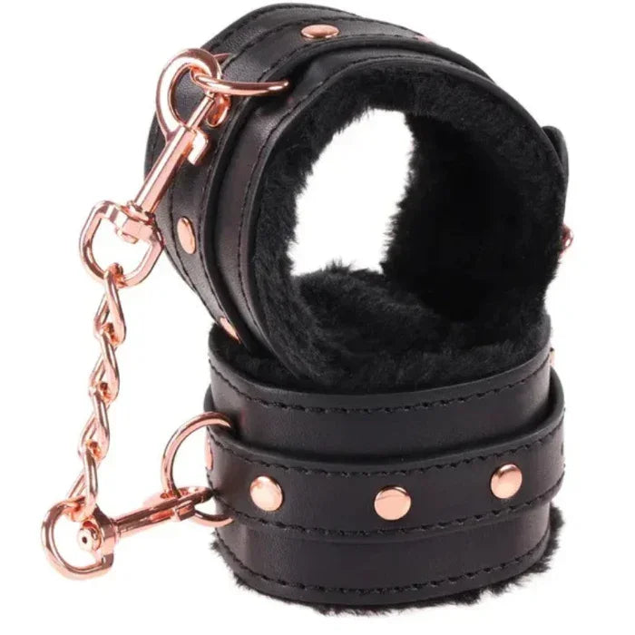 Wrist restraints with rose gold detail and soft lining for comfortable bondage from Sex & Mischief Brat Kit