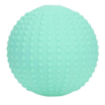 Round green ComfortPulse handheld vibrating massager made of food-grade silicone, shown from the front on a white background.