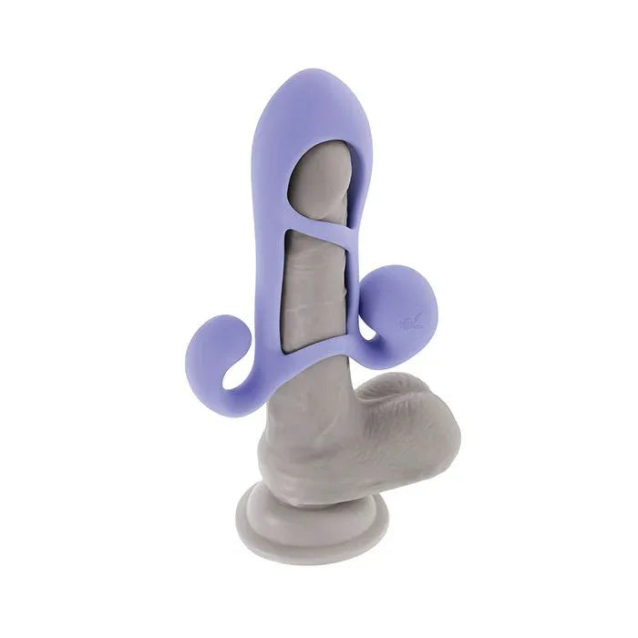 Fantasy Cage by Evolved worn on realistic dildo demonstrating fit, stretched black sleeve adding length with ticklers positioned for clitoral stimulation