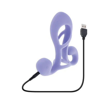 Playboy Fantasy Cage by Evolved Novelties charging via magnetic USB cable, LED indicator lit on black silicone base