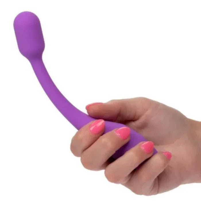 Flex-O-Teaser held in hand showing flexible bend, curved purple silicone shaft positioned for G-spot clitoral stimulation
