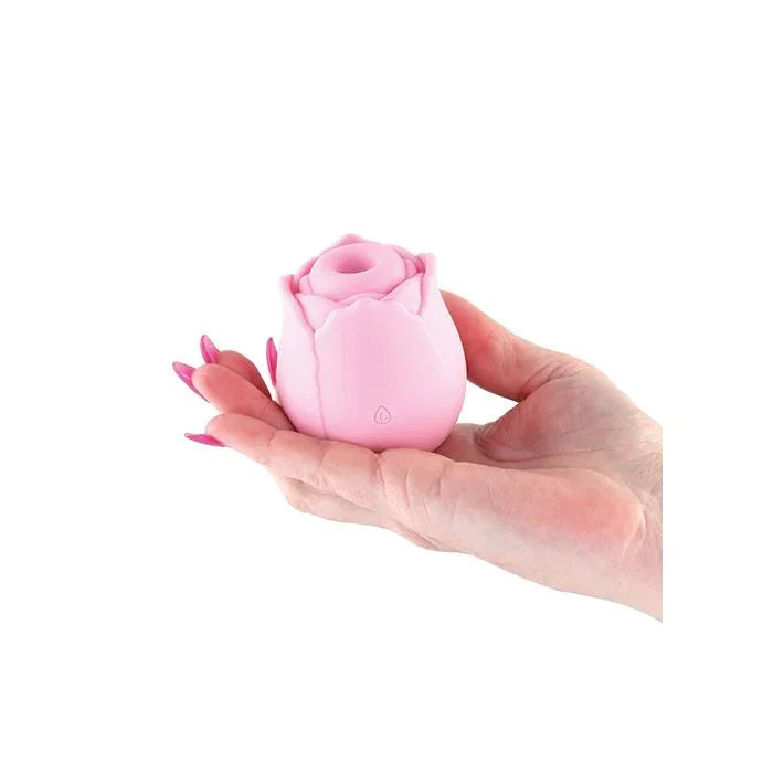 Lifestyle image of person holding the Inya Pink Rose Toy, highlighting compact size and silky texture