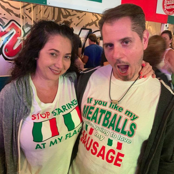 Two people wearing humorous t-shirts with Italian-themed text and graphics.