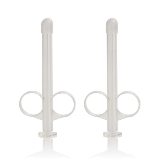 Pair of compact and reusable Lube Tubes designed for exact lubricant dosing, featuring rounded tip and precision plunger on white background
