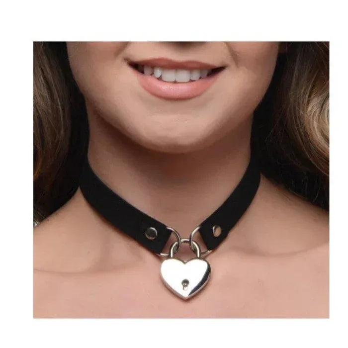 Woman wearing black Lock-It Heart Choker with key, styled as a subtle day collar with lingerie