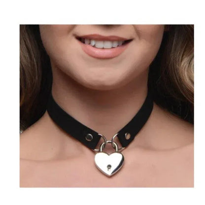 Woman wearing black Lock-It Heart Choker with key, styled as a subtle day collar with lingerie