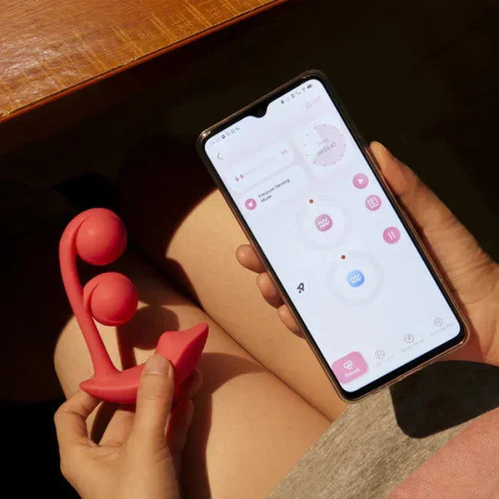 User controlling Melody vibrator vibrations remotely through smartphone app