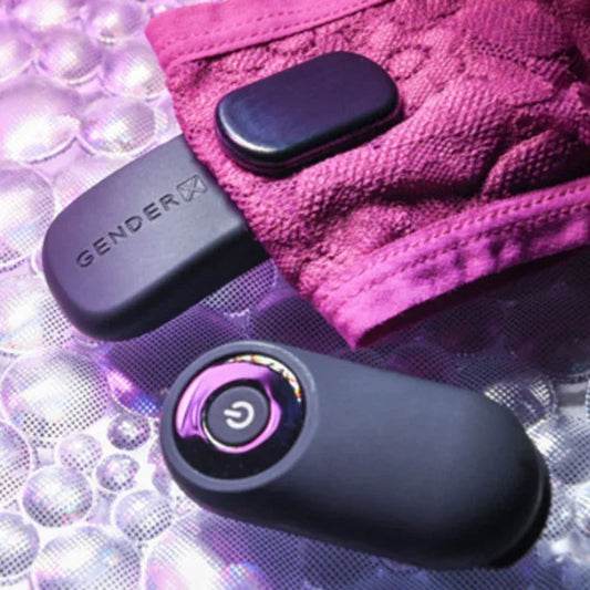 Undie Vibe vibrator attached securely to pink lace underwear with magnetic strip