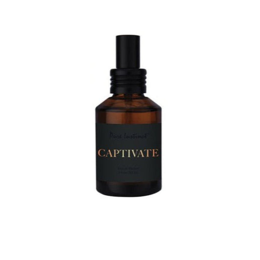 Bottle of Pure Instinct Captivate Pheromone Cologne with vibrant floral and desert fruit design