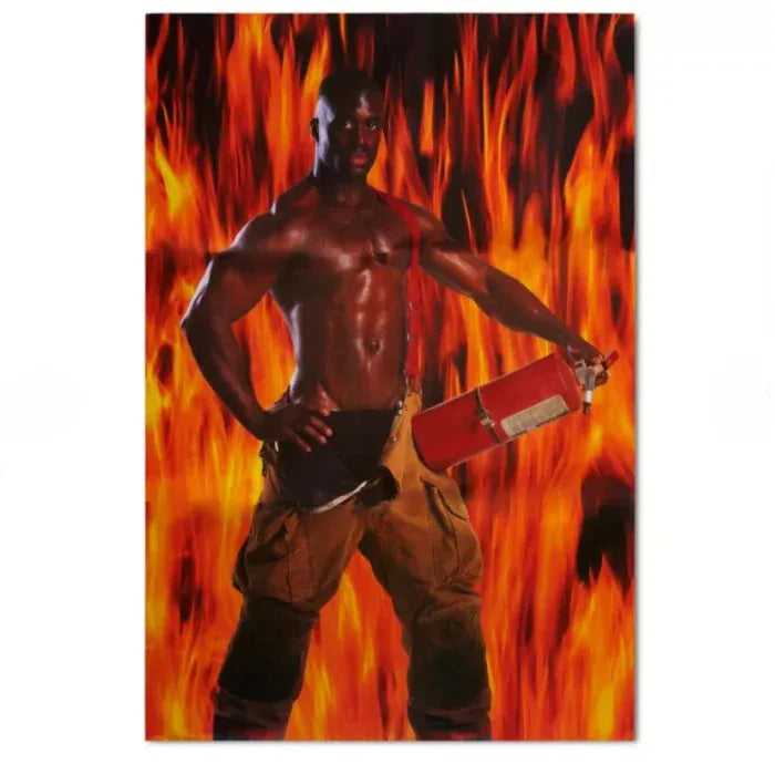 Man holding a fire extinguisher in front of a fiery background