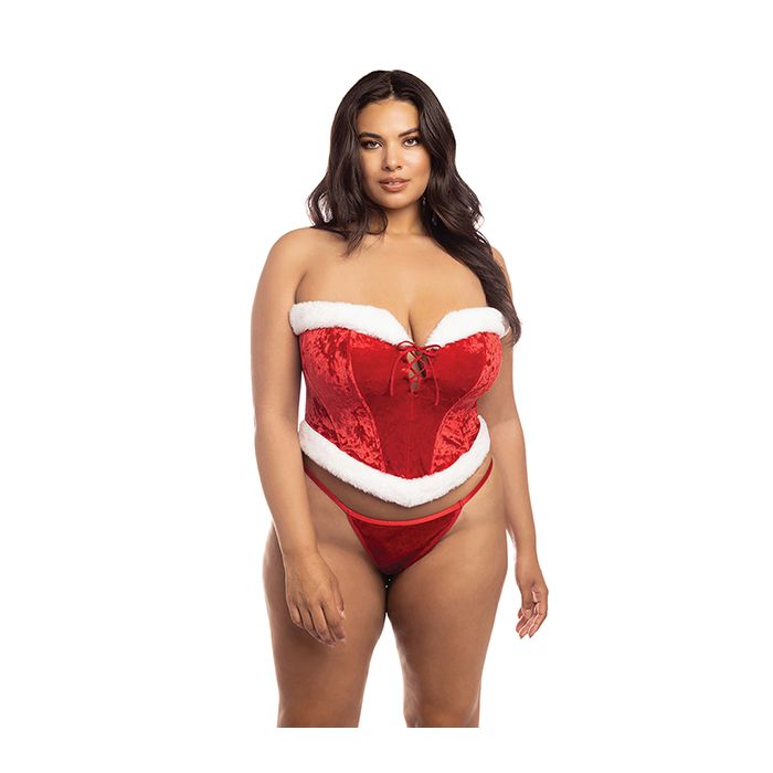 Model wearing size 1x/2x vibrant red velvet bustier costume with marabou trim, lace-up front, and matching G-string, embodying playful holiday roleplay style. 