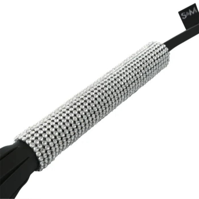 Close-up of sparkle whip handle and shimmering tails
