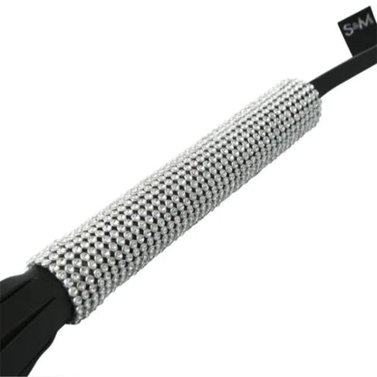Close-up of sparkle whip handle and shimmering tails