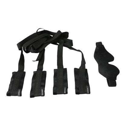 Adjustable black bondage restraints for wrists and ankles in beginner’s kit on a white background