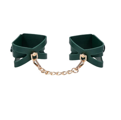 Indica adjustable wrist cuffs in emerald green vegan leather with detachable gold chain connector