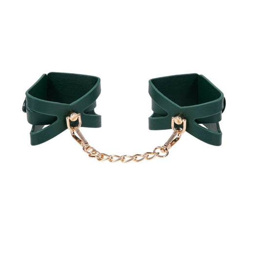 Indica adjustable wrist cuffs in emerald green vegan leather with detachable gold chain connector