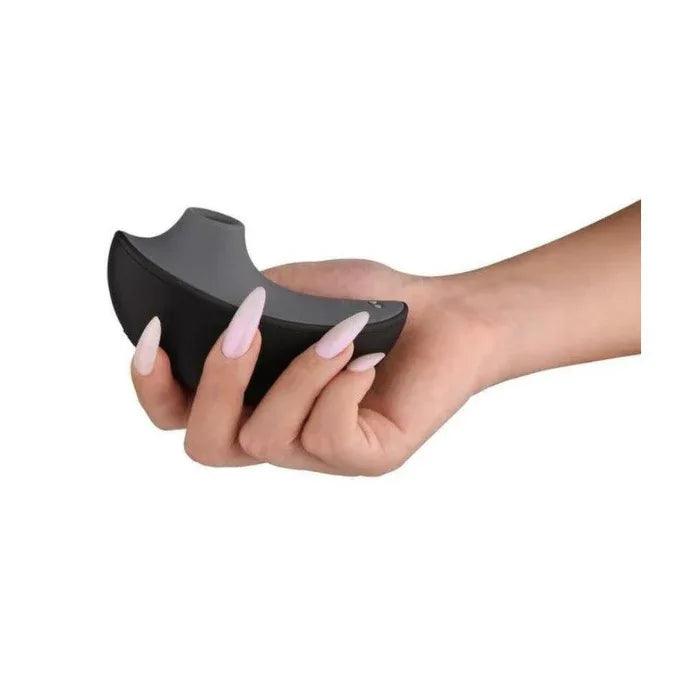 Svakom Pulse Galaxie clitoral stimulator resting in a hand, showing compact ergonomic shape and air-pulse nozzle for precise clitoral stimulation
