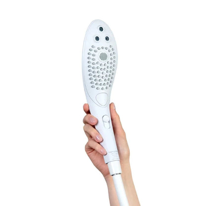 The Womanizer Wave shower head in the hand showcasing the size of the pleasure shower head