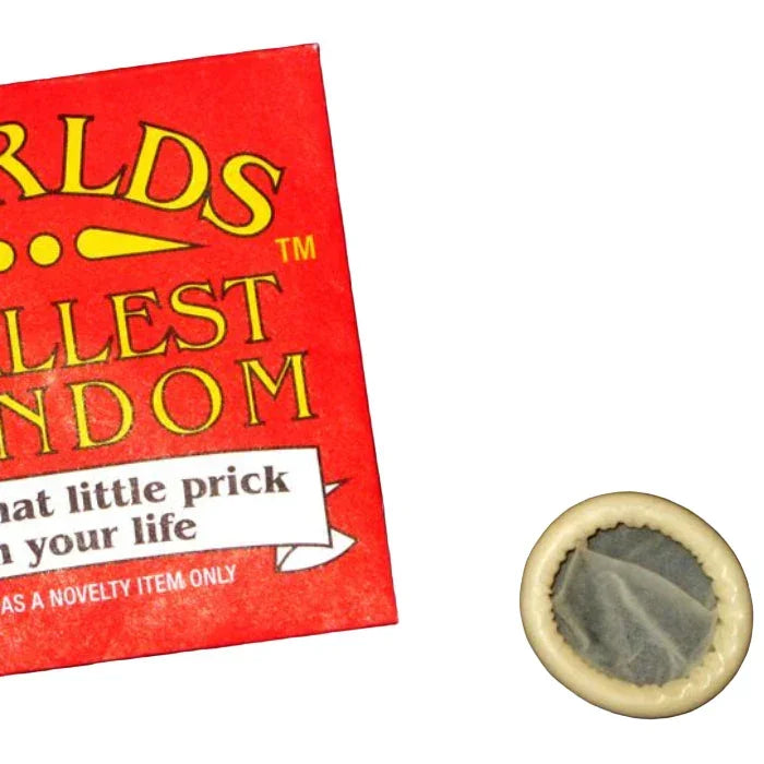 World's Smallest Condom packaging with a small actual condom next to it on a white background