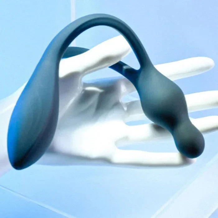 Lifestyle image of someone holding You Me Us Bendable Vibe in black silicone highlighting its waterproof design and dimensions