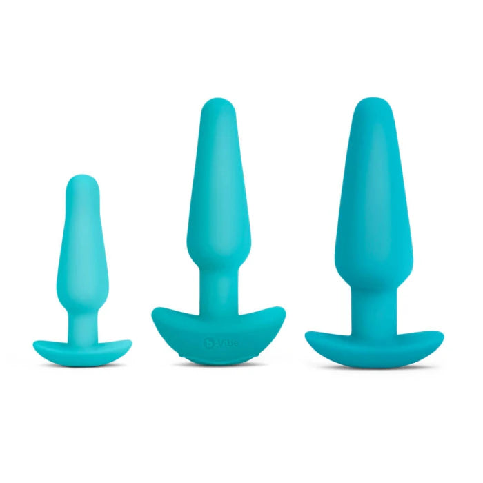 Three graduated silicone anal plugs in slim, medium vibrating, and large weighted sizes