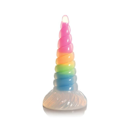 Glow in the dark unicorn dildo standing upright on suction cup