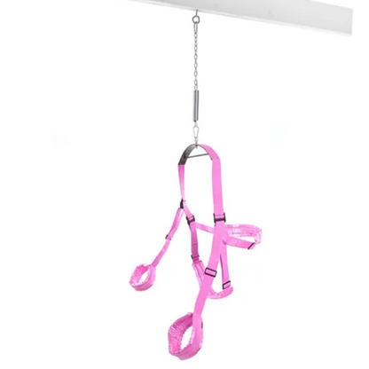 Close-up of padded stirrups and wrist cuffs on adjustable love swing