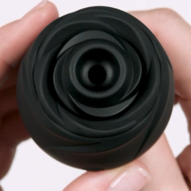 Fifty Shades of Grey Black Rose 2.0 clitoral suction stimulator close-up showing silicone rose petals and central suction opening.