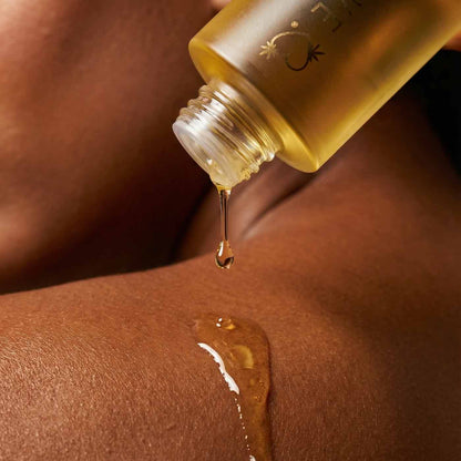 HighOnLove Strawberries & Champagne Massage Oil applied to skin for moisturizing body care and massage