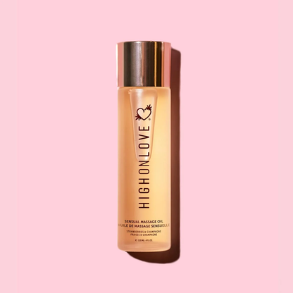 HighOnLove Strawberries & Champagne Massage Oil on pink background