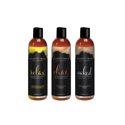 Three bottles of Organic Aromatherapy Massage Oil in different flavors: Relax, Chai, and Naked, each with a distinctively colored label on a white background.