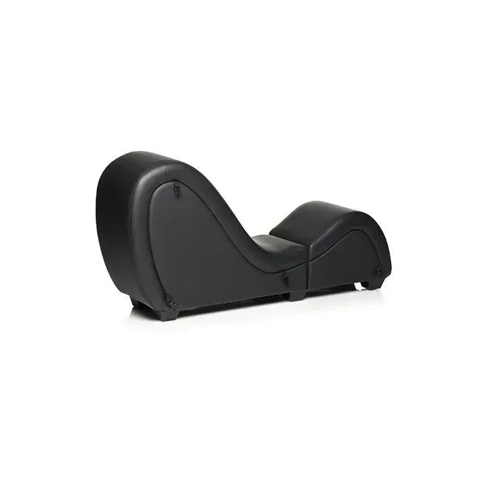 Side profile of the Master Series Kinky Couch black sex chaise lounge showing its curved ergonomic shape and detachable furniture design from angled side view.